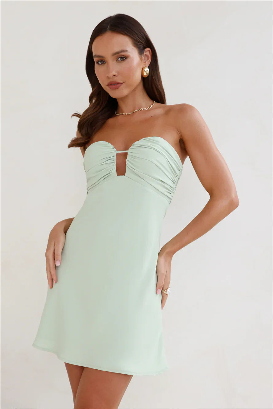 A sweet and spicy strapless mini dress – a must-have for a flirty and alluring look